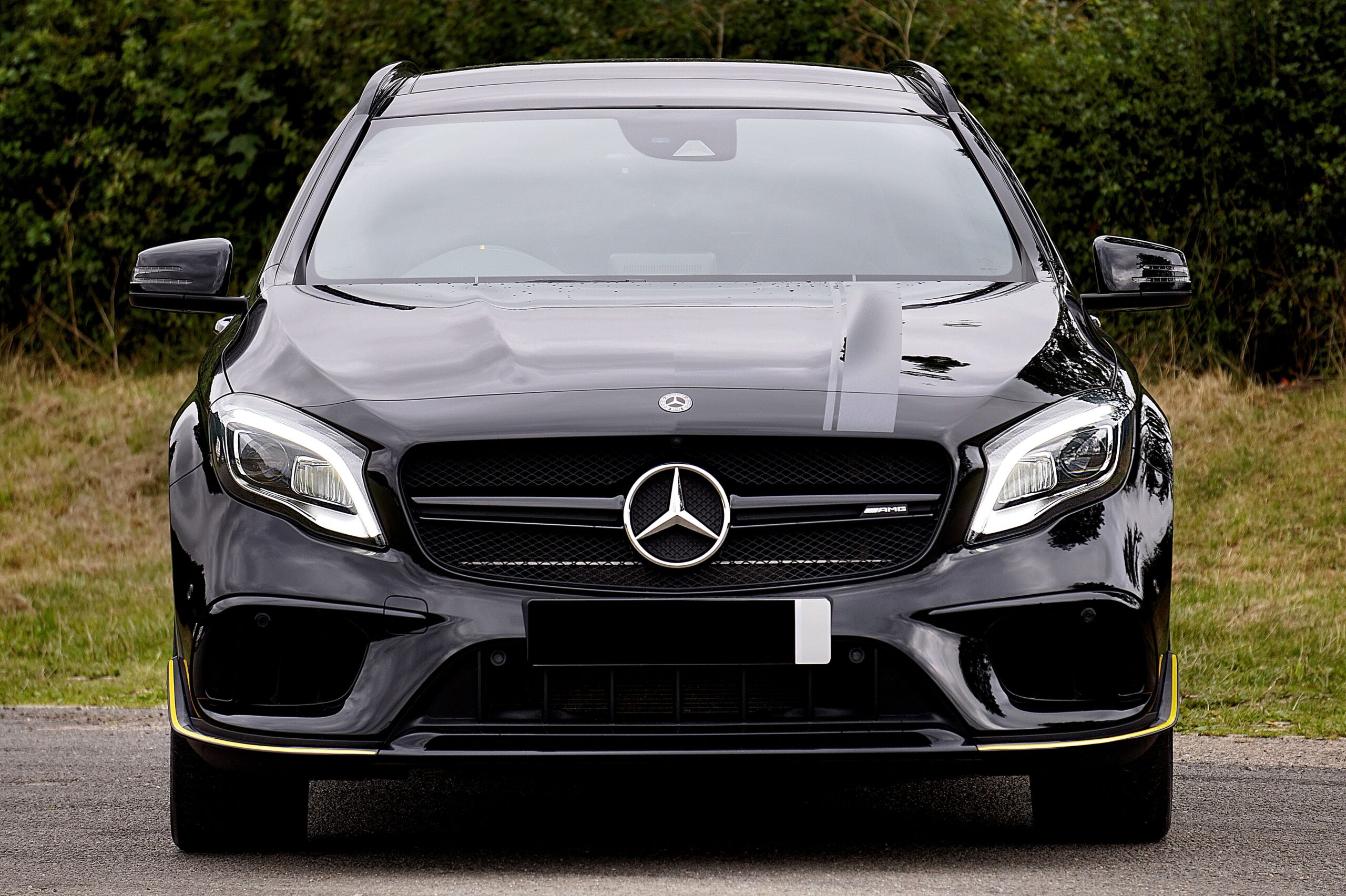 Luxurious black Mercedes-Benz AMG parked outdoors, showcasing elegance and style.